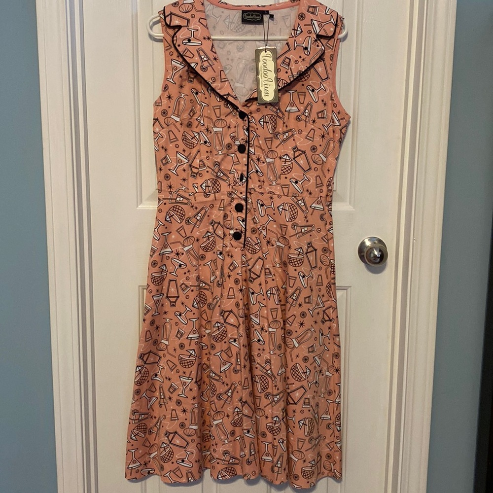 Fun conversation starting dress!  Pink and black print with beverages on it.
